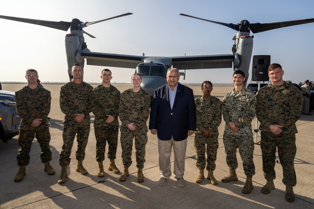 Secretary of the Navy Carlos Del Toro poses for a group photo with Marines after presenting them with challenge coins in recognition of their exemplary performance and outstanding contributions to their units at Marine Corps Air Station Miramar, California, Dec. 4, 2024. Secretary Del Toro toured the installation to engage with servicemembers and assess ongoing efforts to improve quality of life, operational readiness, and infrastructure at MCAS Miramar. (U.S. Marine Corps photo by Sgt. Santicia Ambriez-Stippey)