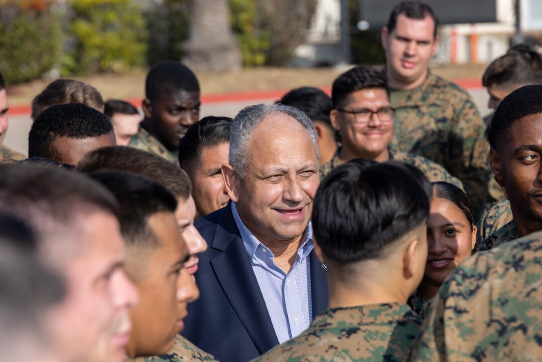 Secretary of the Navy Carlos Del Toro poses for photos with Marines after a town hall event with Marine Aircraft Groups 11 and 16, 3rd Marine Aircraft Wing, on the flight line at Marine Corps Air Station Miramar, California, Dec. 4, 2024. Secretary Del Toro toured the installation to engage with servicemembers and assess ongoing efforts to improve quality of life, operational readiness, and infrastructure at MCAS Miramar. (U.S. Marine Corps photo by Sgt. Santicia Ambriez-Stippey)