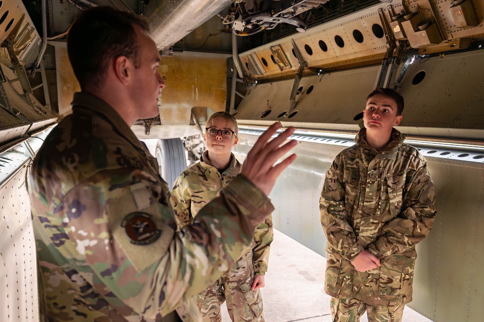 1st Lt. Jeremiah Tackett, 20th Expeditionary Bomb Squadron combat systems officer, speaks to Royal Air Force Air Cadets during a community outreach event Dec. 4, 2024, at RAF Fairford, England.