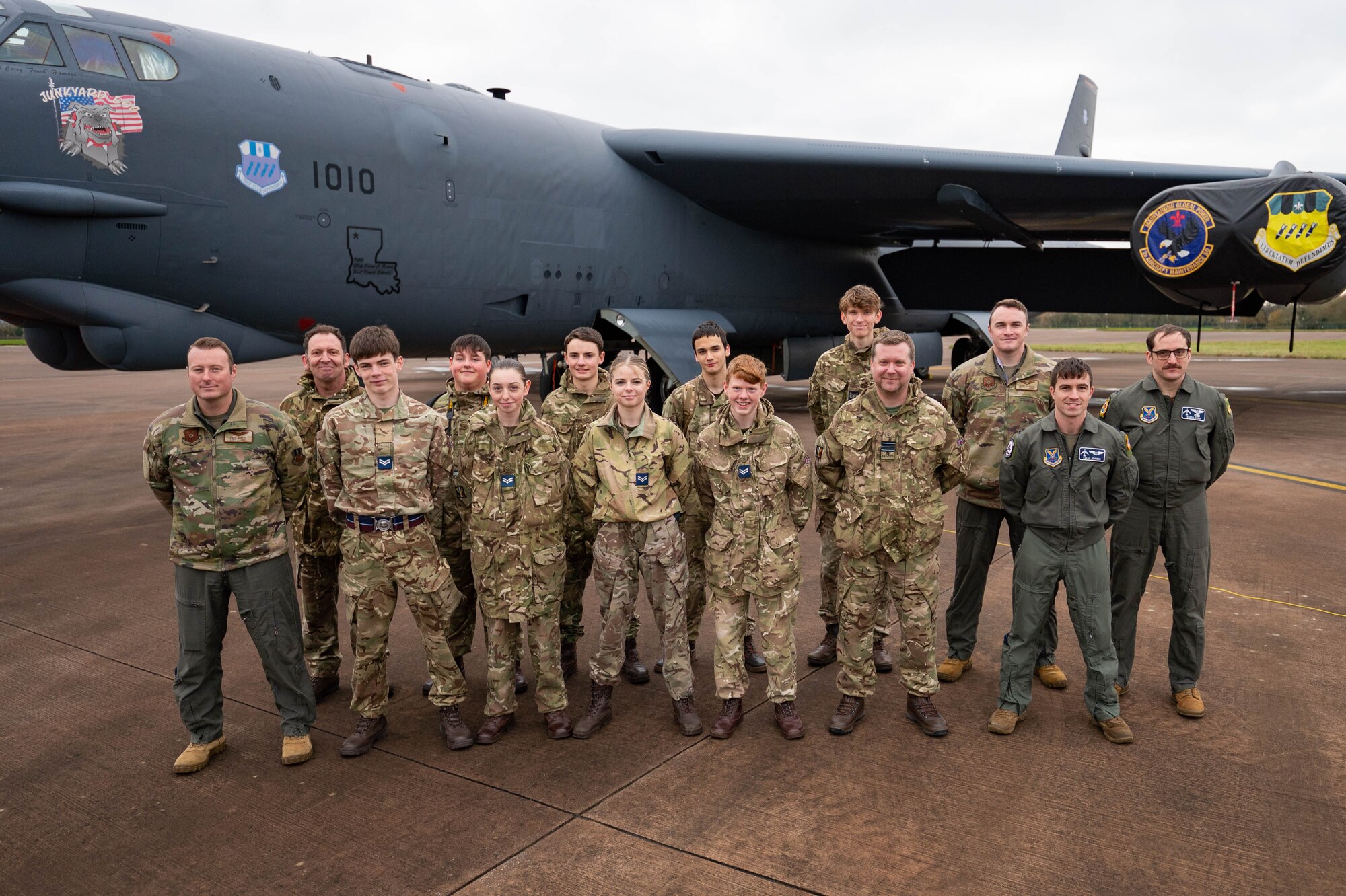 Airmen from the 20th Expeditionary Bomb Squadron and Royal Air Force Air Cadets stand together during a community outreach event Dec. 4, 2024, at RAF Fairford, England.