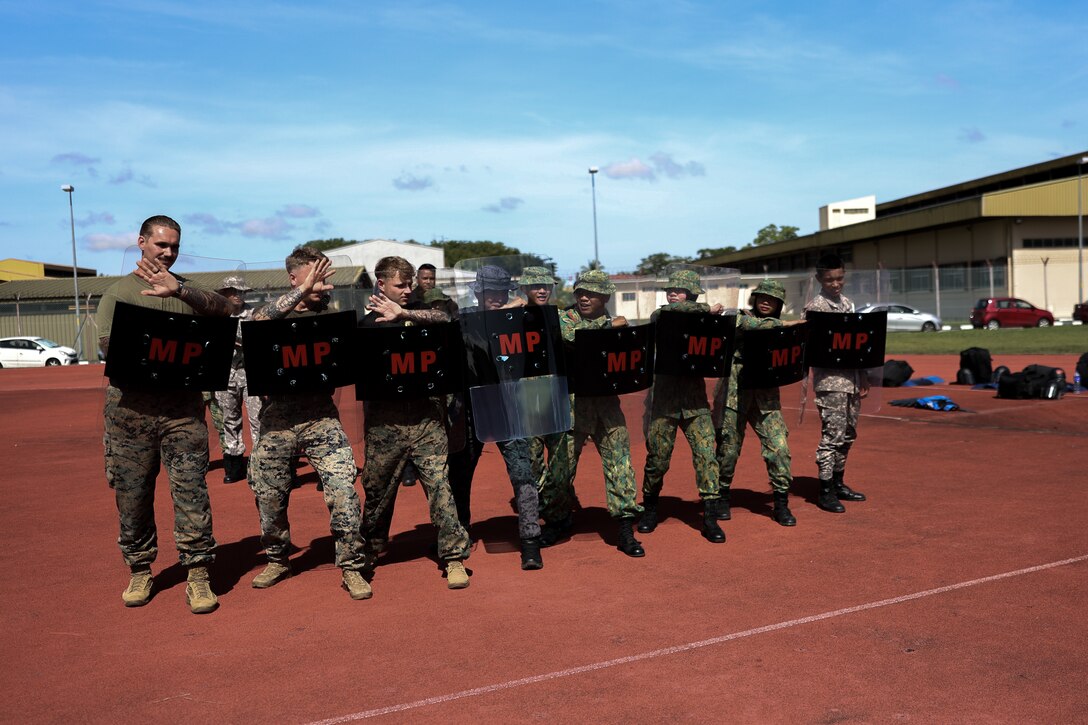 Service members with the Royal Brunei Armed Forces and U.S. Marines with Marine Rotational Force - Southeast Asia, participate in a non-lethal subject matter expert exchange for exercise Cooperation Afloat Readiness and Training Brunei 2024 on Bandar Seri Begawan, Brunei, Nov. 20, 2024. CARAT Brunei is conducted annually by the Royal Brunei Armed Forces, the U.S. Navy and the U.S. Marine Corps in order to build relations and maintain a free and open Indo-Pacific. MRF-SEA is a rotational unit derived from elements of I Marine Expeditionary Force executing a U.S. Marine Corps Forces, Pacific operational model that involves training events and exchanges with partner military subject matter experts, promotes security goals with Allied and partner nations, and ensures a persistent I MEF presence west of the International Date Line. (U.S. Marine Corps photo by Cpl. Tyler Wilson)