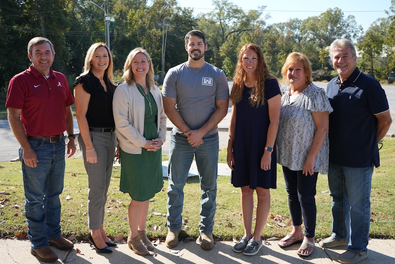 SUBMAT Program Manager Timothy Rushing (far left) poses with team members (L-R) Megan Buffington, Alicia Bounds, Ben Rutherford, Allison Hudson, Terry-Ann Stanton, and Stan Boc. Not pictured are Melissa Keen and Zach Tyler. (U.S. Army Corp of Engineers photo by Megan Buffington.)
