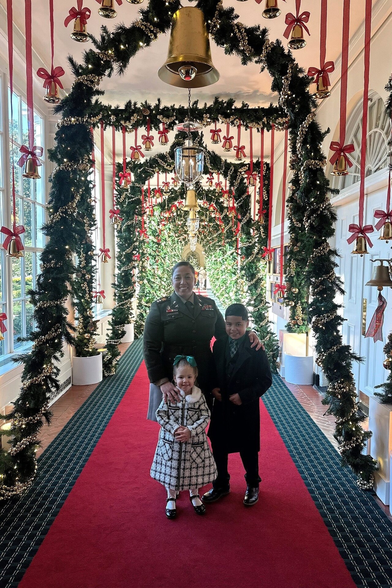 Capt. Nicole Barela-Vess and her children, Michael and Isabella, tour the White House in Washington, D.C., after attending First Lady Jill Biden’s Joining Forces Holiday Reception Dec. 2, 2024. (Courtesy photo)