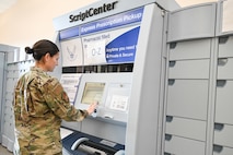 An Airman in an Operational Camouflage Pattern (OCP) uniform uses the ScriptCenter kiosk inside the Hill AFB Exchange.