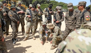 U.S. Air Force Tech. Sgt. Becker Almarsumi, a linguist with the 439th Supply Chain Operations Squadron, translates the exercise plan to U.S. Army Soldiers from 1st Battalion, 175th Infantry Regiment, Maryland National Guard, at African Lion 2024 (AL24) in Bizerte, Tunisia, May 7, 2024. AL24 marks the 20th anniversary of U.S. Africa Command’s premiere joint exercise led by U.S. Army Southern European Task Force, Africa (SETAF-AF), running from April 19 to May 31 across Morocco, Ghana, Senegal and Tunisia, with over 8,100 participants from 27 nations and NATO contingents. (U.S. Army Photo by Spc. Shawn Fogleman)