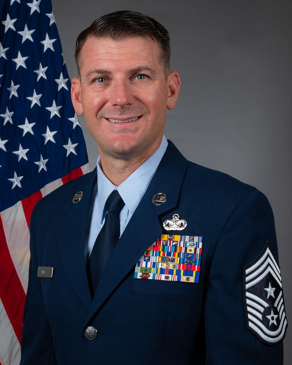 Command Chief Master Sgt. Chris Mertz is pictured in an official portrait wearing the U.S. Air Force service dress uniform.