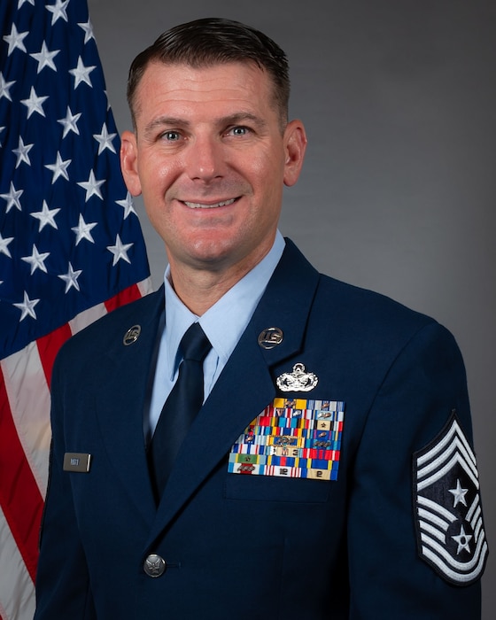 Command Chief Master Sgt. Chris Mertz is pictured in an official portrait wearing the U.S. Air Force service dress uniform.