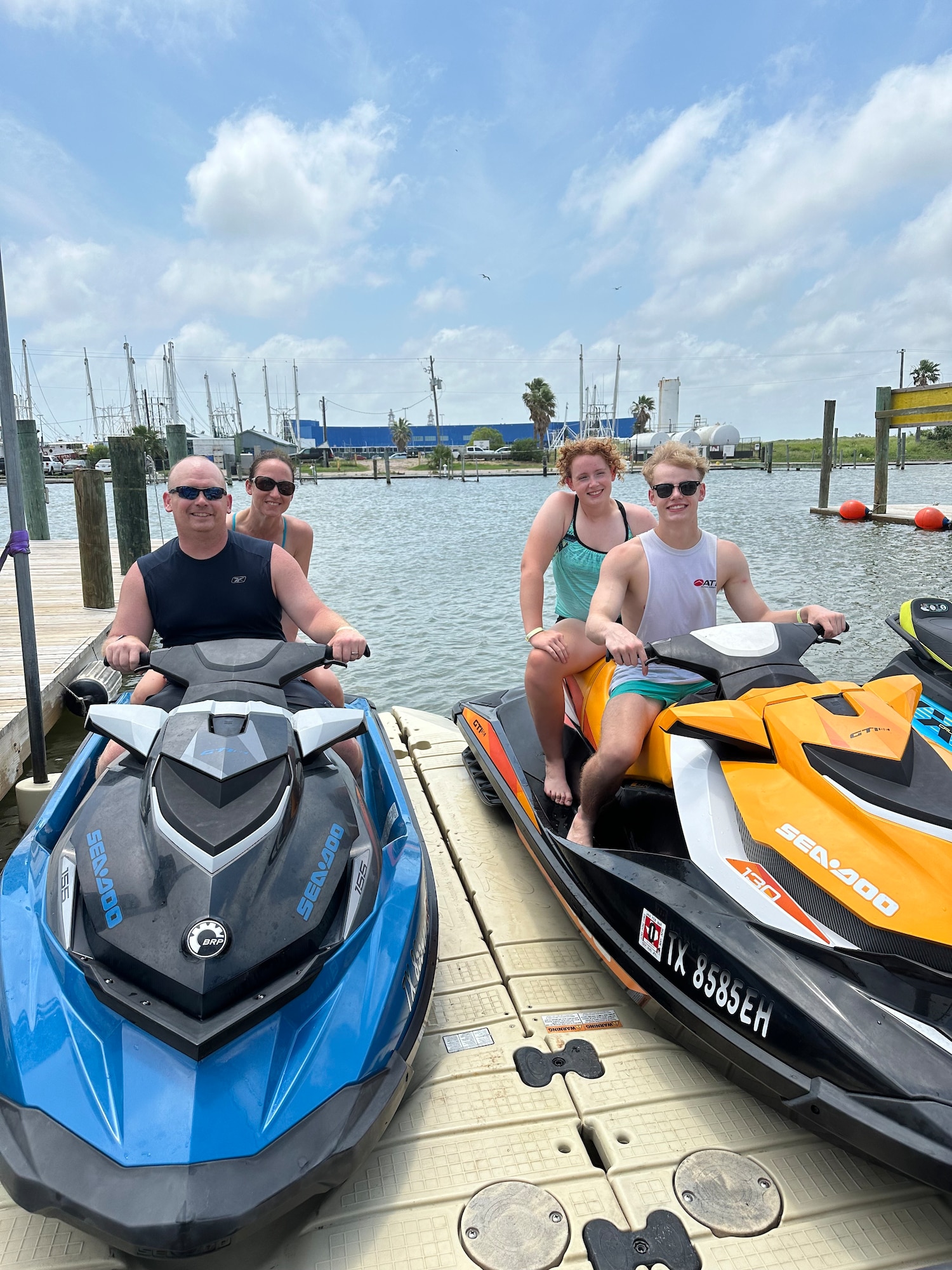 A family of four on jet skis