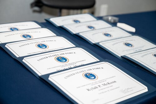 Image of certificates on a table.
