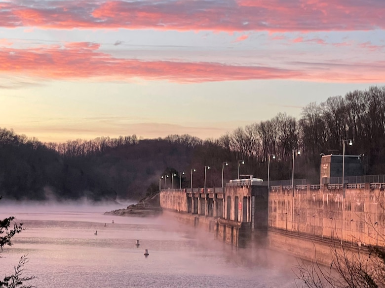 A beautiful sunrise paints Dale Hollow Dam Dec. 20, 2024. The multi-purpose dam project is located on the Obey River in Celina, Tennessee, and impounds Dale Hollow Lake. (USACE Photo by Crystal Tingle)
