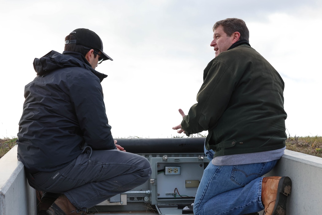 Two engineers conduct a Target Interface Inspection for a range at Fort McCoy, Wisconsin.