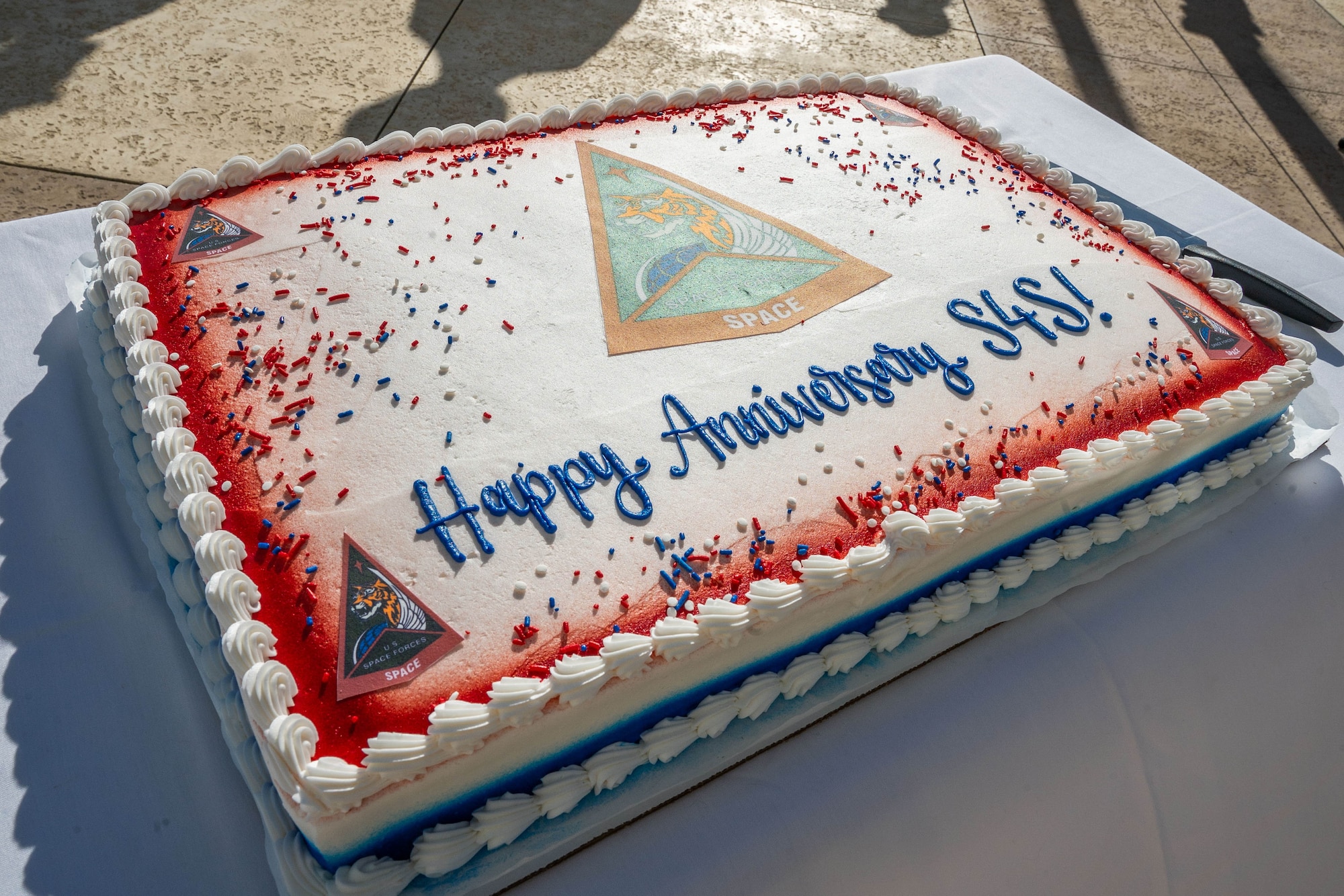 A cake is decorated with the message "Happy Birthday S4S!"