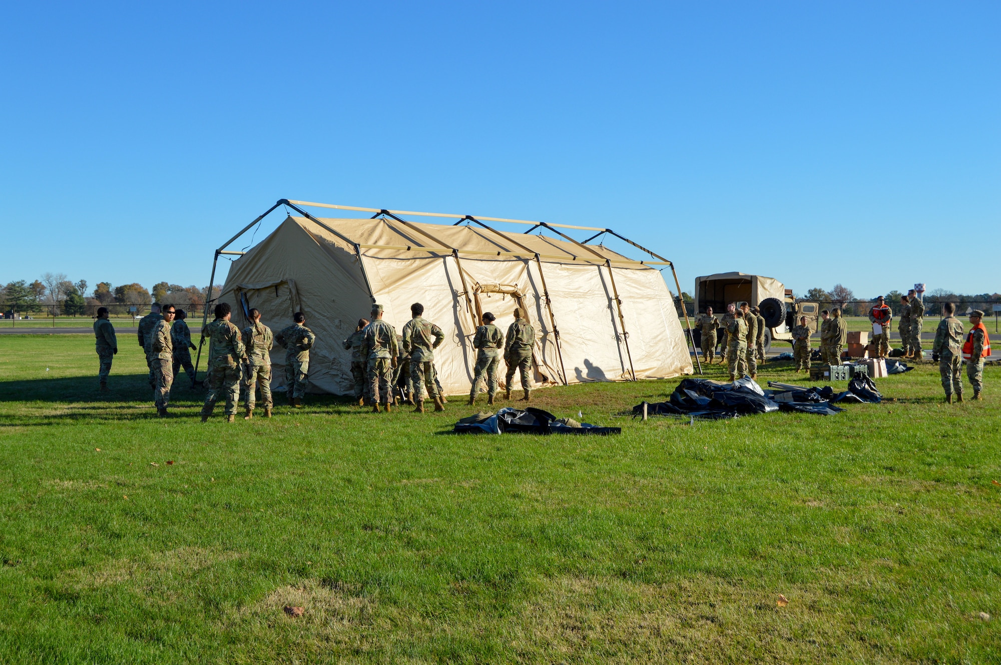 Airmen prepare an En Route Patient Staging System for a Theater Aeromedical Evacuation System training