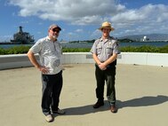 Organizers, Jim Neuman, the history and outreach manager for Navy Region Hawaii (left) and David Kilton (right), the interpretation, education, and services lead for the National Park Service, pose for a photo in the contemplation circle near the USS Arizona Memorial after discussing plans for the commemoration ceremonies this week, which honor the 83rd anniversary of the attack on Pearl Harbor on Dec. 7, 1941.
