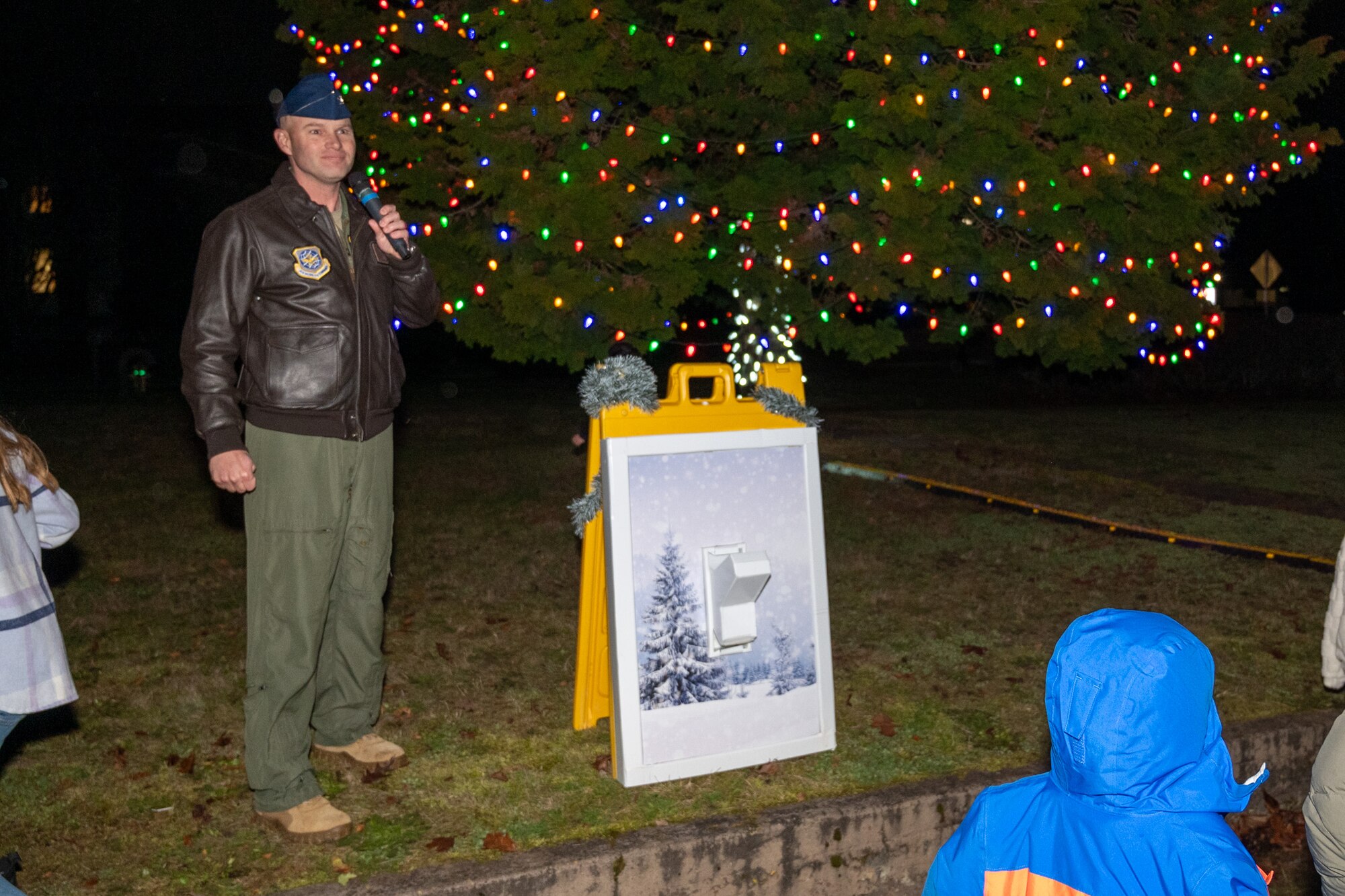 U.S. Air Force Col. John Berger, 62d Airlift Wing deputy commander, makes his holiday remarks during the annual Team McChord holiday tree lighting ceremony at Joint Base Lewis-McChord, Washington, Dec. 5, 2024.