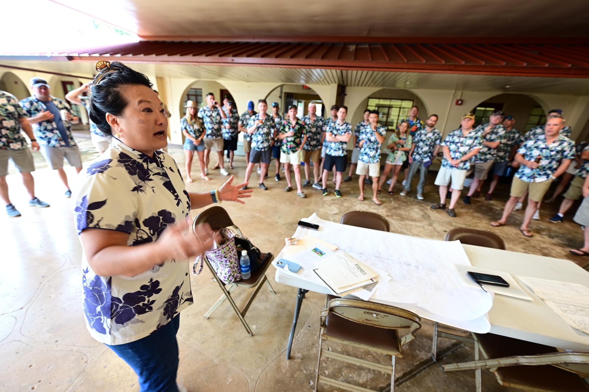 Jessie Higa, Joint Base Pearl Harbor-Hickam volunteer historian, shares the movements of Lieutenants Kenneth Taylor and George Welch, 47th Pursuit Squadron pilots, on the day Pearl Harbor was attacked to pilots of the now 47th Fighter Squadron while on a tour at the base in Oahu, July 27, 2024. During the tour, Higa showed the pilots where Welch and Taylor slept, the location of the bomb strikes, and shared her feelings on the sacrifices made during that fateful day. (U.S. Air Force Photo by MSgt Courtney Richardson)