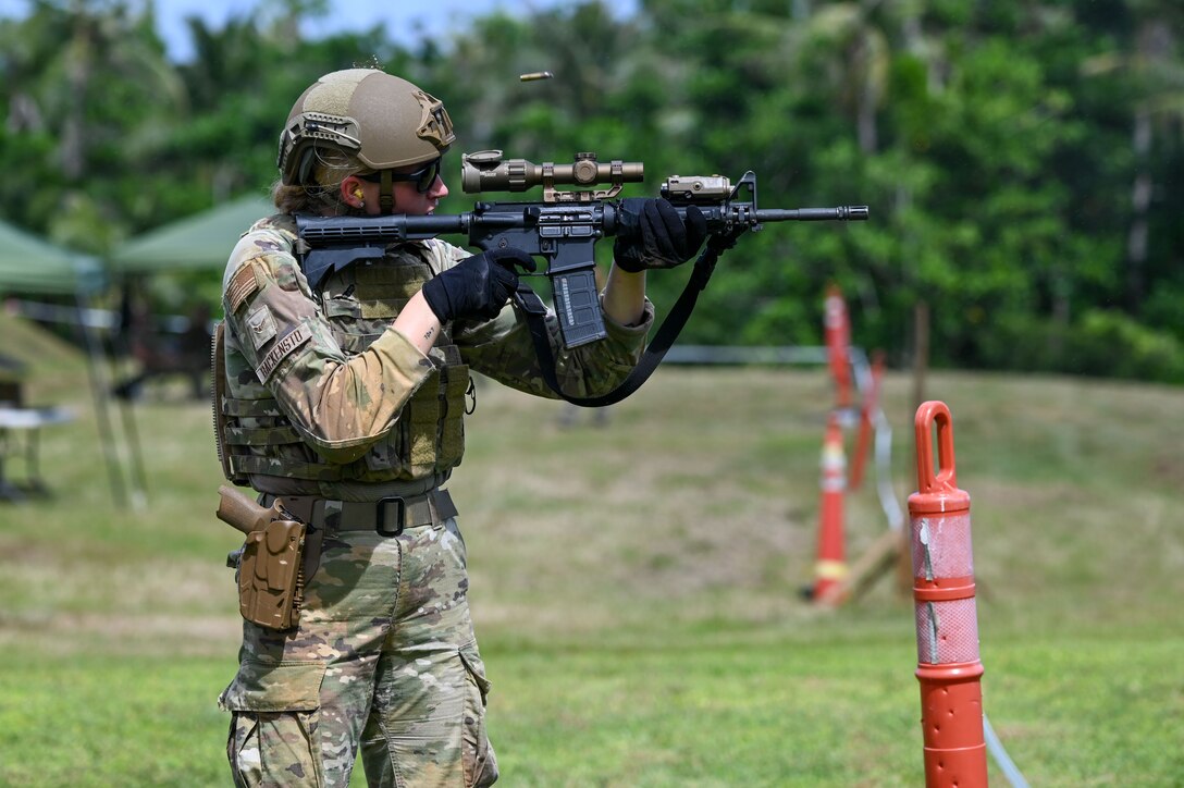 Airman firing a rifle