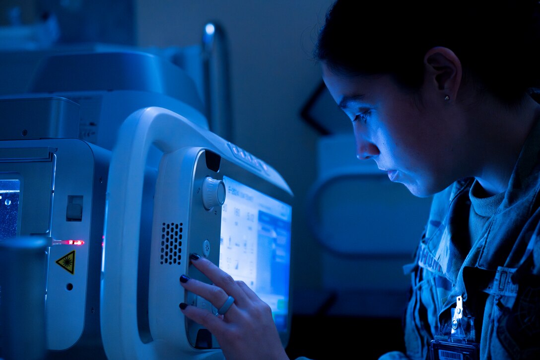 Airman using a x-ray machine