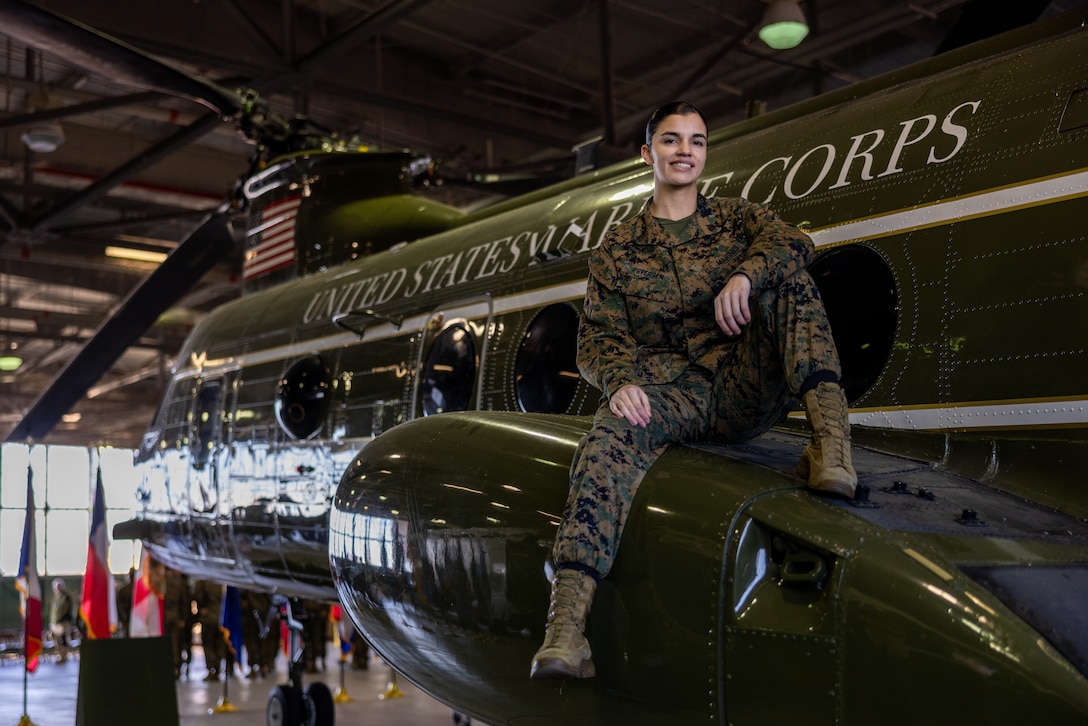 U.S. Marine Corps Sgt. Shelby Petersen, a vocalist with Marine Corps Quantico Band, poses on a Boeing Vertol CH-46 Sea Knight at Marine Corps Air Facility Quantico, on MCBQ, Virginia, Dec. 3, 2024. Petersen, a Kalispell, Montana native, enlisted as an Aviation Ordnance Systems Technician in the year 2020, and submitted for a lateral move in 2023 to her current military occupational specialty. “If it’s a dream of yours, don’t give up on it,” Petersen said definitively. “No matter where you are in life, whatever opportunities you get or lack-thereof, it’s really important to take the time for the things that make you feel alive and make your soul feel whole.” (U.S. Marine Corps photo by Lance Cpl. Braydon Rogers)
