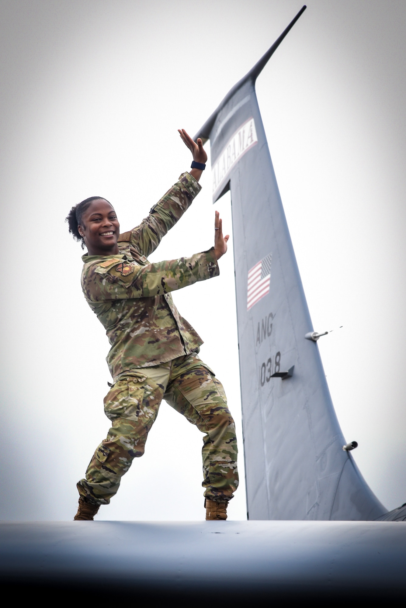 Master Sgt. Stephanique Watkins poses on top of a KC-135 Stratotanker