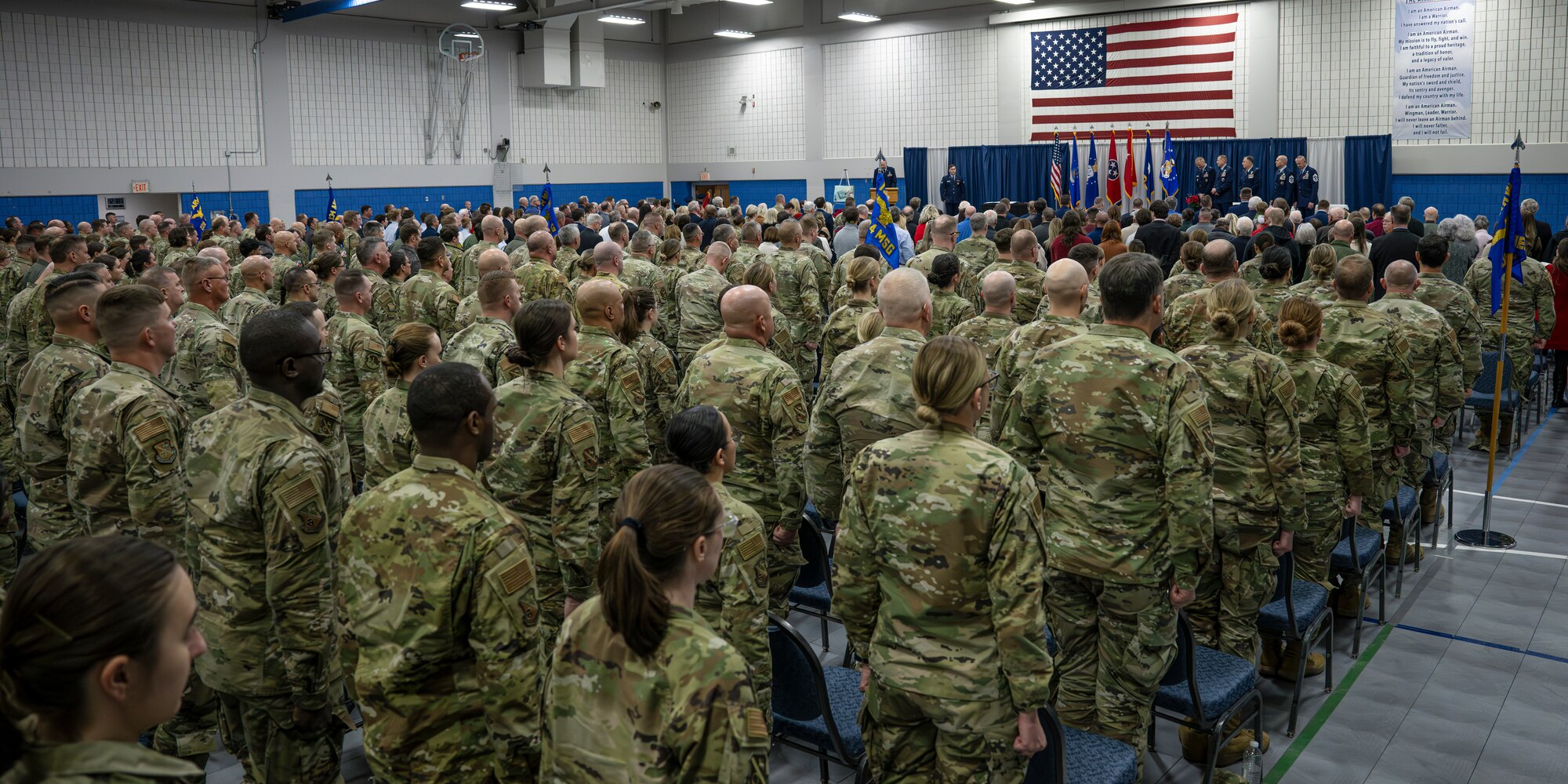 Airmen from the 134th Air Refueling Wing and other state officials stand to recognize eleven Distinguished Flying Cross recipients at a ceremony on McGhee Tyson Air National Guard Base, Knoxville, Tennessee, December 7, 2024.