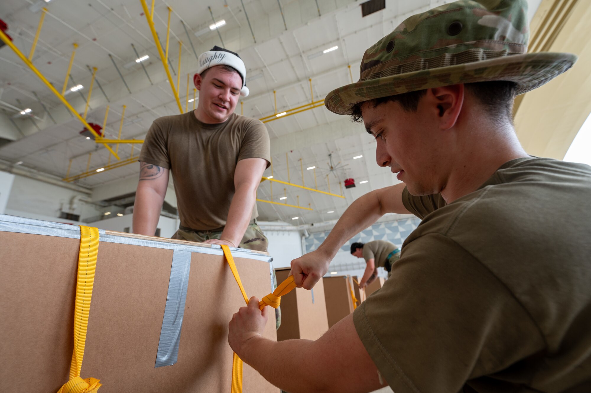 LRS Airmen prepare bundles for Operation Christmas Drop 2024