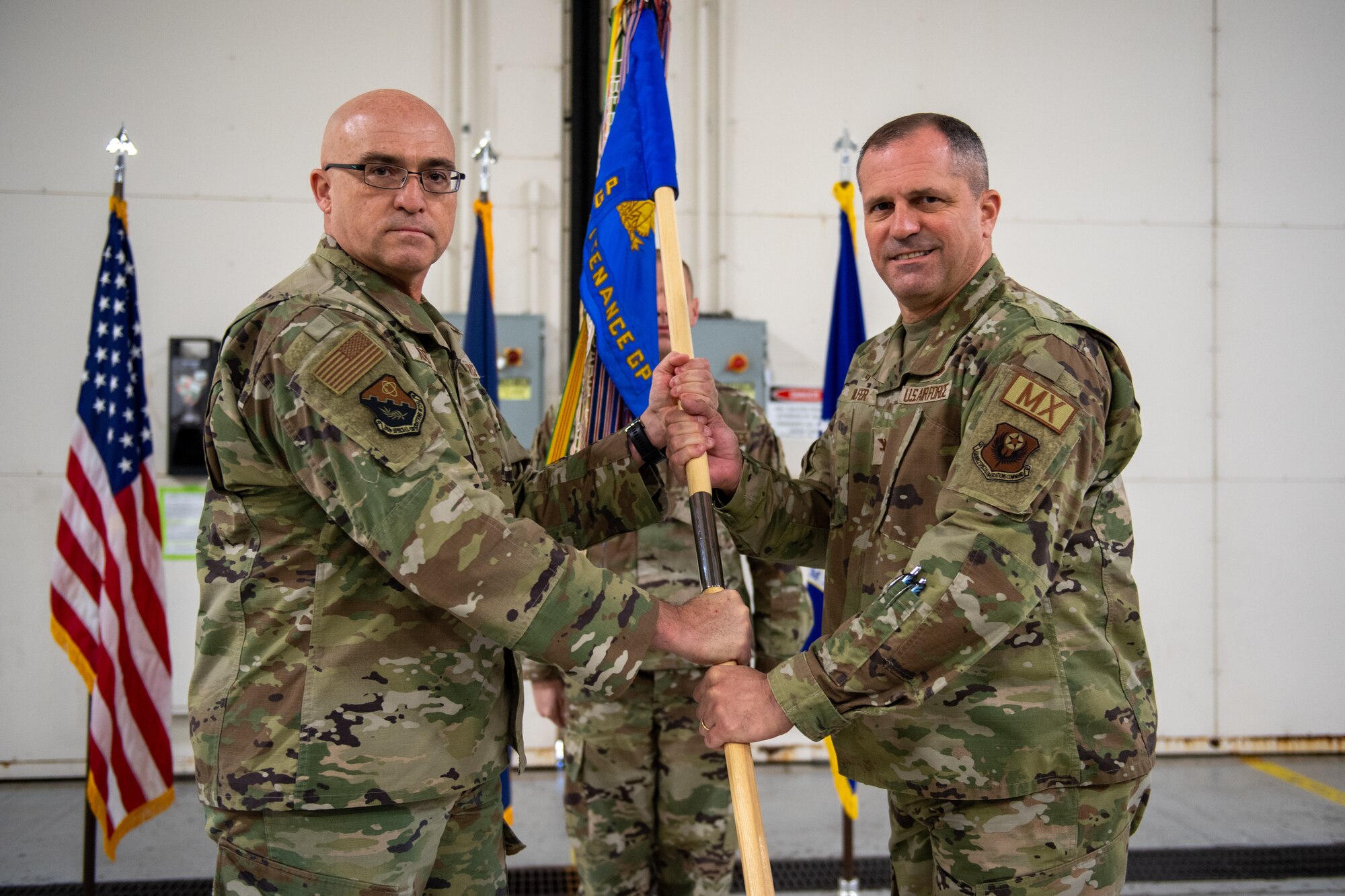 Col. Steven Fulfer (right) receives the guidon from Col. Robert Noren, 193rd Special Operations Wing commander, during an assumption of command ceremony for the 193rd Special Operations Maintenance Group in Middletown, Pa., Dec. 7, 2024.