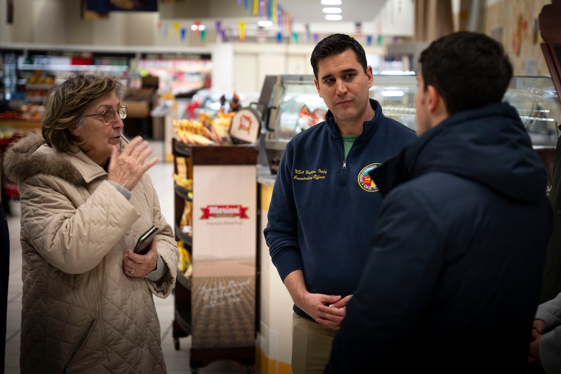 NAVAL SUPPORT ACTIVITY NAPLES, Italy (December 5, 2024) Vittorio Lettieri (right), Mayor of Gricignano, Aversa, Italy engages with Capt. John Randazzo (center), Commander, Naval Support Activity (NSA) Naples, Italy, during a tour of the commissary onboard NSA Support Site in Gricignano Dec. 5, 2024. The visit provided an opportunity to strengthen the partnership between NSA military community and Gricignano community. NSA Naples is an operational ashore base that enables U.S., allied, and partner nation forces to be where they are needed, when they are needed to ensure and stability in the European, African, and Central Command areas of responsibility. (U.S. Navy photo by Mass Communication Specialist 1st Class Haydn N. Smith)