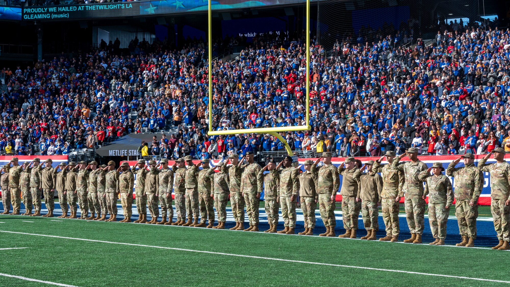 Reserve Citizen Airmen from the 514th Air Mobility Wing, Joint Base McGuire-Dix-Lakehurst, N.J., attend and participate in a Salute to Service New York Giants game at MetLife Stadium, N.J., November 17, 2024. Prior to the game, the Freedom Wing members were invited onto the field to watch the warm-ups and pose for photos with Giants players. As the game began, they formed the gauntlet through which the Giants ran to take the field.