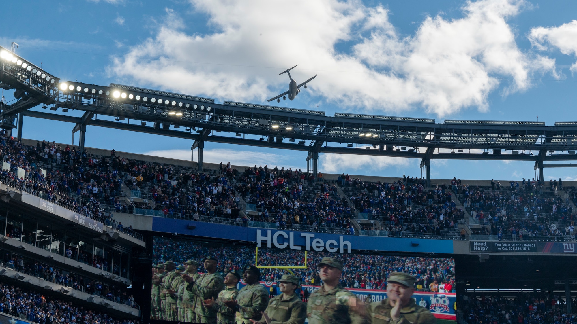 Reserve Citizen Airmen from the 732nd Airlift Squadron, Joint Base McGuire-Dix-Lakehurst, N.J., conduct a C-17 Globemaster III flyover during a Salute to Service New York Giants game at MetLife Stadium, N.J., November 17, 2024. Prior to the game, the Freedom Wing members were invited onto the field to watch the warm-ups and pose for photos with Giants players. As the game began, they formed the gauntlet through which the Giants ran to take the field.