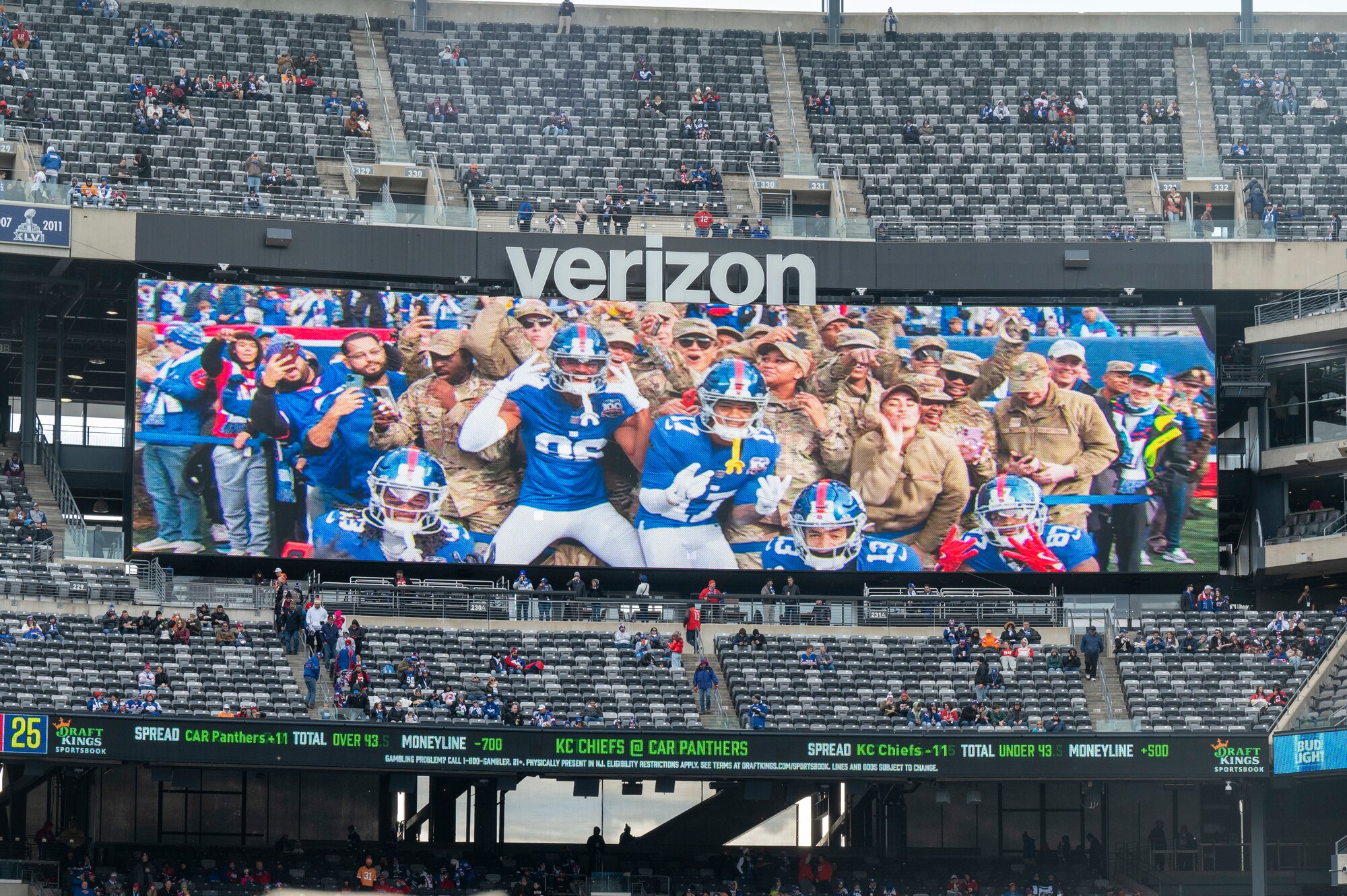 Reserve Citizen Airmen from the 514th Air Mobility Wing, Joint Base McGuire-Dix-Lakehurst, N.J., attend and participate in a Salute to Service New York Giants game at MetLife Stadium, N.J., November 17, 2024. Prior to the game, the Freedom Wing members were invited onto the field to watch the warm-ups and pose for photos with Giants players. As the game began, they formed the gauntlet through which the Giants ran to take the field.