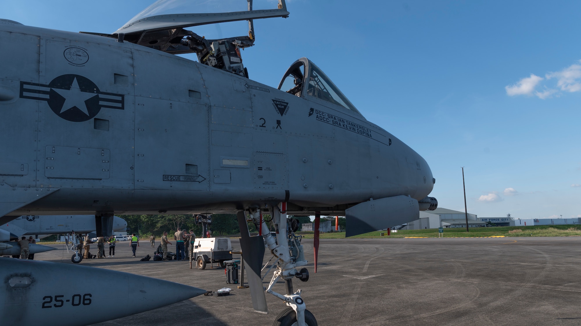 The front half of a fighter jet parked on a tarmac