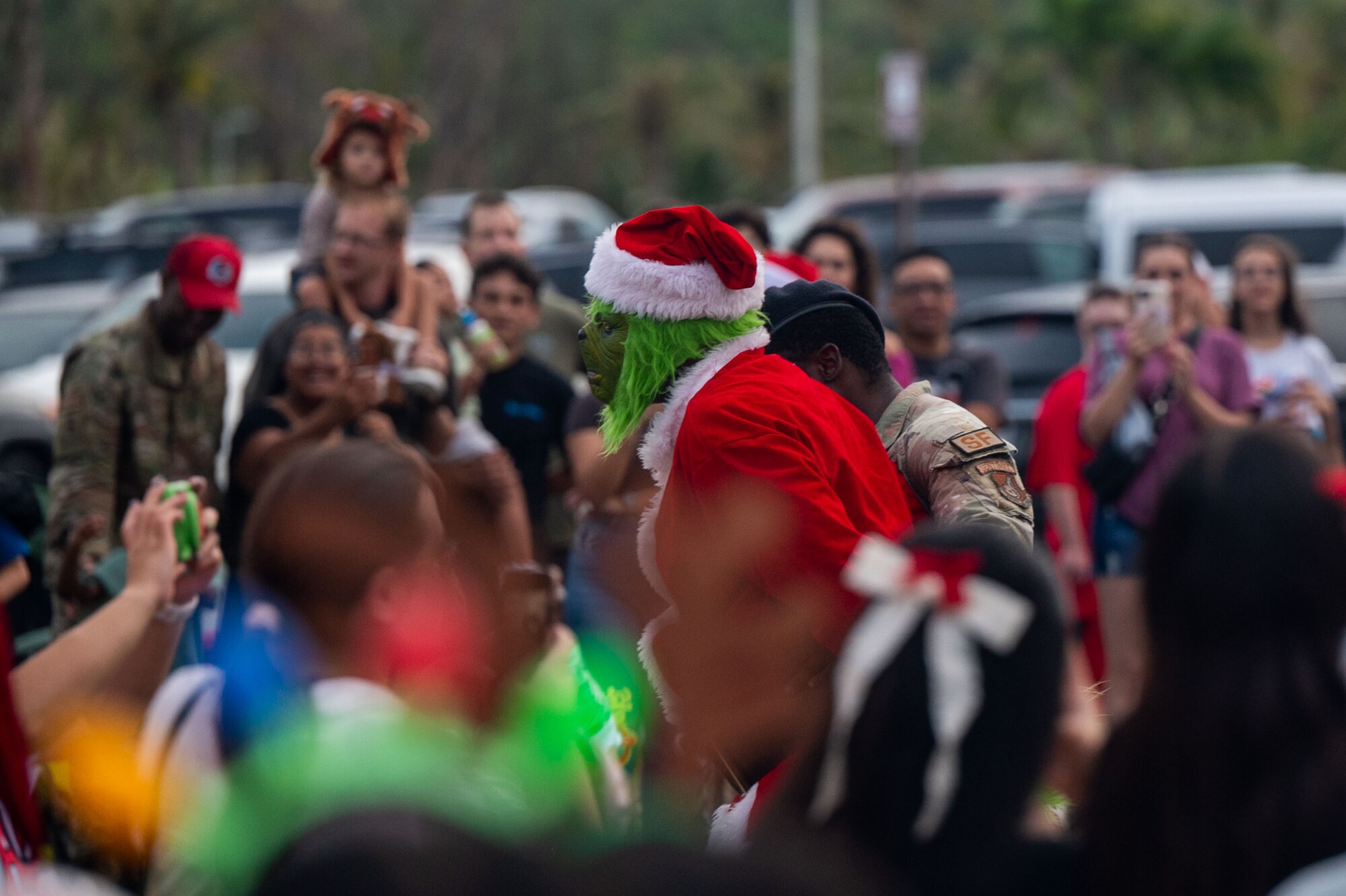 Family and friends rallied together at the Tree Lighting Ceremony to celebrate the start of the holiday season by meeting Santa and enjoying live music, face painting, games and more. (U.S. Air Force photo by Airman 1st Class Audree Campbell)