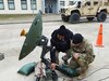 Duane Stevens, a Logistics Assistance Representatives from U.S. Army Communications-Electronics Command who is assigned to Logistics Support Team-Africa in Vicenza, Italy, provides over-the-shoulder training to deployed Soldiers. (U.S. Army courtesy photo)