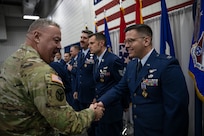 U.S. Army National Guard Maj. Gen. Warner Ross III, Tennessee National Guard adjutant general, left, congratulates recipients of the Distinguished Flying Cross during a ceremony at McGhee Tyson Air National Guard Base, Knoxville, Tennessee, Dec. 7, 2024. The Distinguished Flying Cross is one of the U.S. military’s most prestigious honors, authorized by Congress in 1926, and is awarded for acts of heroism or extraordinary achievement in aerial flight.