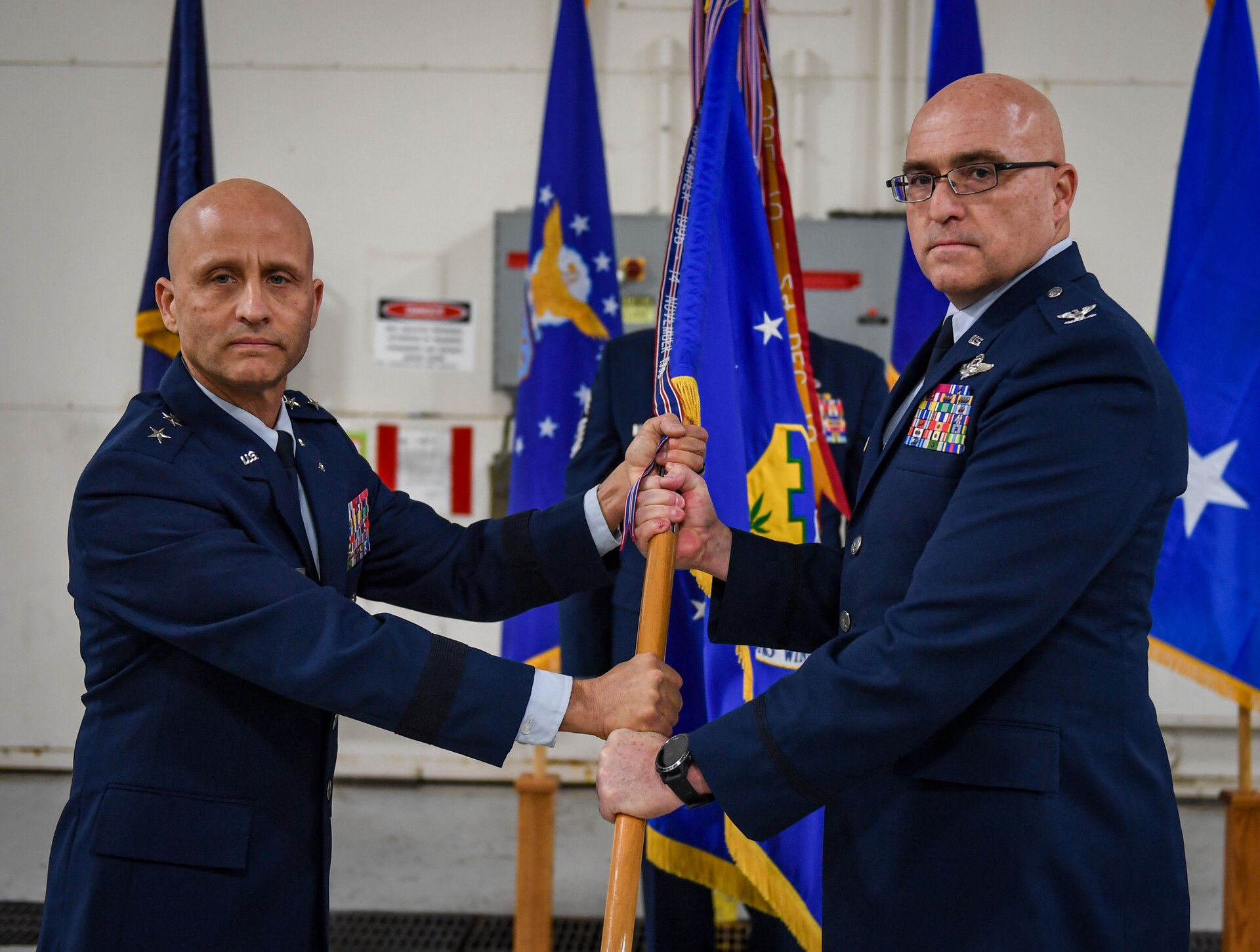Maj. Gen. Terrence Koudelka, Pennsylvania Air National Guard commander (left), presides over an assumption of command ceremony in which Col. Robert S. Noren, assumes command of the 193rd Special Operations Wing, Dec. 6, 2024 in Middletown, Pa. In his new position, Noren commands more than 1,900 Airmen in wartime and contingency operations, as well as providing military support to civilian authorities. (U.S. Air National Guard photo by Senior Master Sgt. Alexander Farver)