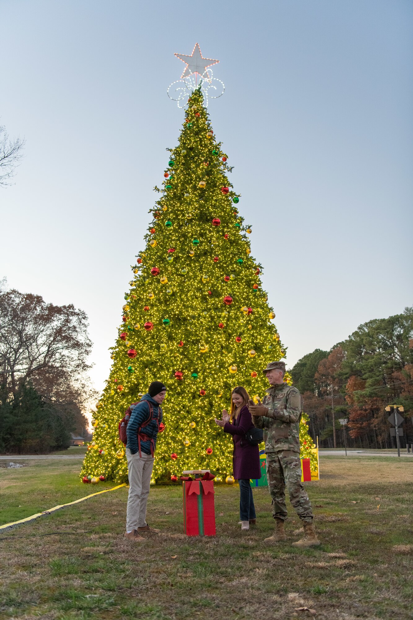 The Christmas tree at Arnold Air Force Base, Tenn., is lit during a lighting ceremony Dec. 3, 2024. This is the second year in a row Arnold team members and their families have gathered for the ceremony. The tree, purchased in 2023, measures 40 feet tall and 22 feet wide. It is decorated with approximately 300 ball ornaments and is topped with a 5-foot 3D five-point star. (U.S. Air Force photos by Keith Thornburgh)