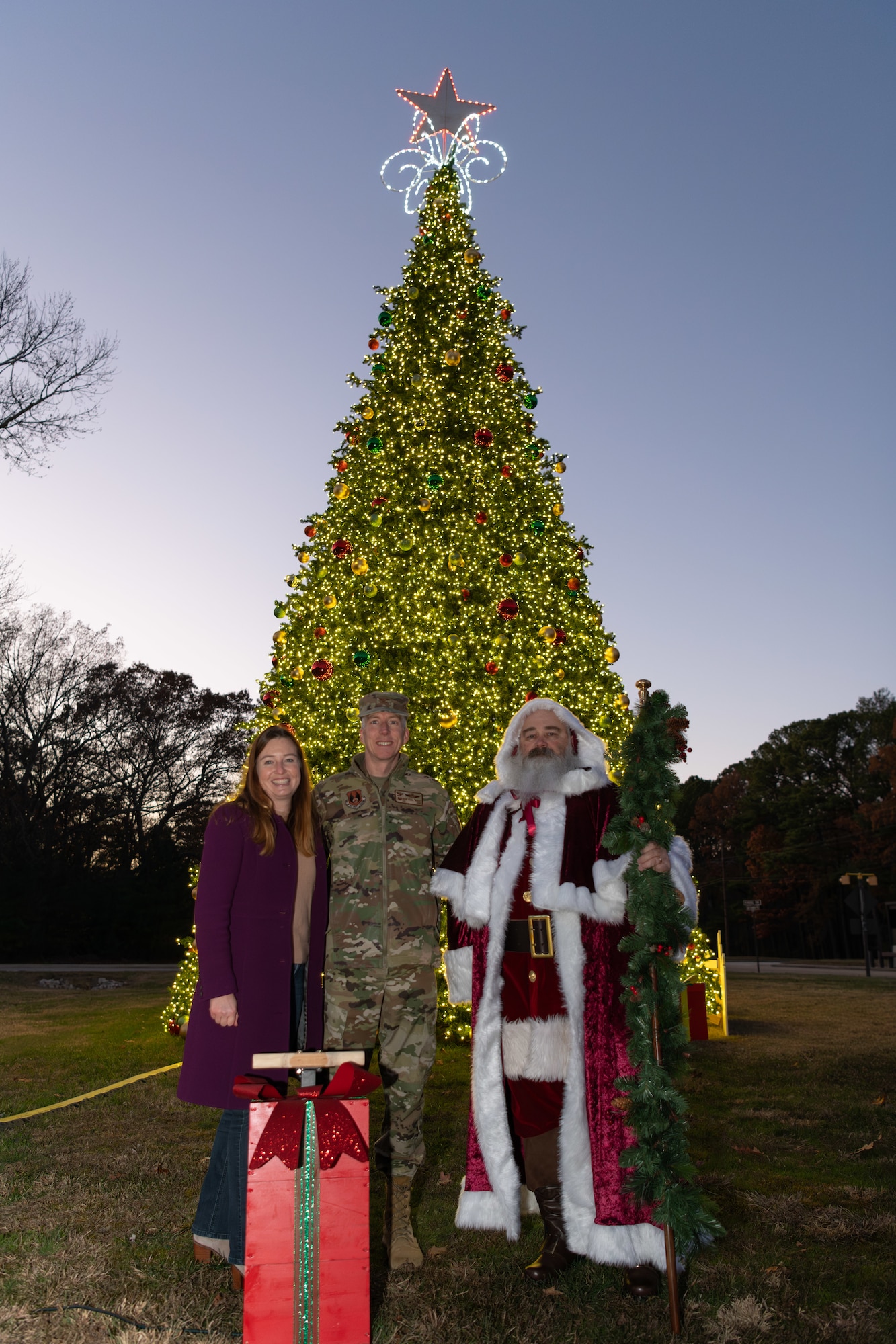 The Christmas tree at Arnold Air Force Base, Tenn., is lit during a lighting ceremony Dec. 3, 2024. This is the second year in a row Arnold team members and their families have gathered for the ceremony. The tree, purchased in 2023, measures 40 feet tall and 22 feet wide. It is decorated with approximately 300 ball ornaments and is topped with a 5-foot 3D five-point star. (U.S. Air Force photos by Keith Thornburgh)