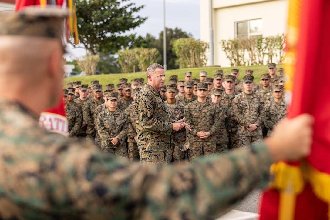 U.S. Marine Corps Col. Richard Barclay, center, speaks to members of 4th Marine Regiment on Camp Schwab, Okinawa, Japan, Nov. 21, 2024. 4th Marine Regiment and its subordinate battalions’ colors have not been unified since 1977. While 4th Marines is headquartered in Okinawa, its subordinate battalions are stationed in the continental U.S. and participate in rotational deployments under the Unit Deployment Program and with Marine Expeditionary Units. Barclay, a native of Indiana, is the commanding officer of 4th Marine Regiment, 3d Marine Division. (U.S. Marine Corps photo by Cpl. Noah Masog)