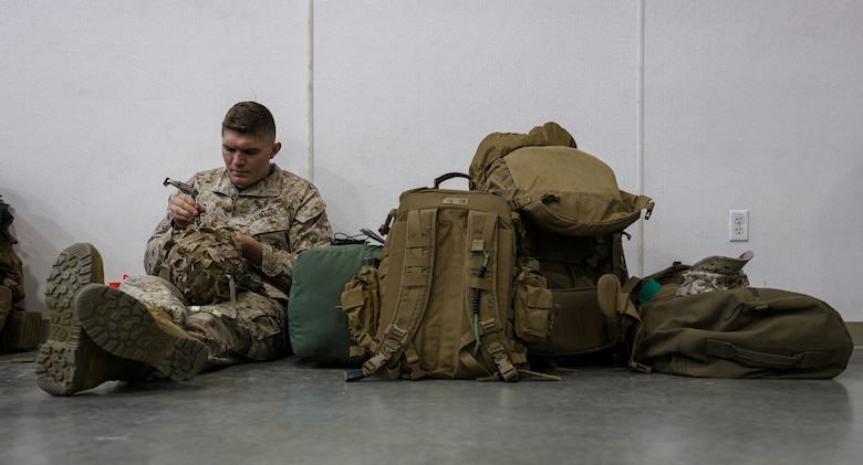 U.S. Marine Corps 1st Lt. Alex Allred, a platoon commander with Fox Company, 2nd Battalion, 23d Marine Regiment, 4th Marine Division prepares his Kevlar helmet during his unit’s activation for the unit deployment program at Camp Williams, Utah, Nov. 2, 2024. The activation marks the beginning of an intensive period of training for 2nd Battalion, 23d Marines as they provide a total force solution in support of the UDP by aligning Marine Forces Reserve’s commitment to Marine Corps strategic objectives. This marks the first time since 2020 that an entire Reserve infantry battalion has activated to support the Unit Deployment Program. (U.S. Marine Corps photo by Cpl. Aaron TorresLemus)