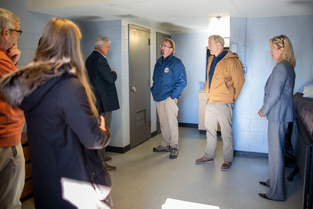 U.S. House of Representatives Chuck Edwards (R-NC), center left, and Matt Cartwright (D-PA), center right, tour a barracks room at Marine Corps Base Camp Lejeune, North Carolina, Dec. 2, 2024. The Congressional Delegation (CODEL) was a bi-partisan visit consisting of House Appropriations Subcommittee on Defense (HAC-D) representatives who learned more about II MEF operations, capabilities and address issues related to DoD appropriations in North Carolina. (U.S. Marine Corps photo by Sgt. Jacquilyn Davis)