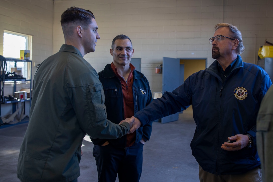 U.S. Marine Corps Sgt. Luke Vespestad, left, motor technician mechanic with the 26th Marine Expeditionary Unit, II Marine Expeditionary Force, shake hands with U.S. House of Representatives Chuck Edwards (R-NC) at Marine Corps Base Camp Lejeune, North Carolina, Dec. 2, 2024. The Congressional Delegation (CODEL) was a bi-partisan visit consisting of House Appropriations Subcommittee on Defense (HAC-D) representatives who learned more about II MEF operations, capabilities and address issues related to DoD appropriations in North Carolina. (U.S. Marine Corps photo by Sgt. Jacquilyn Davis)