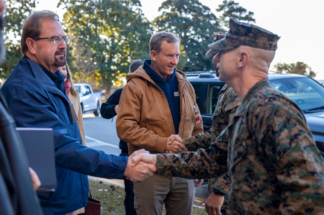 U.S. Marine Corps Sgt. Maj. David Wilson, the sergeant major of II Marine Expeditionary Force, greets U.S. House of Representatives Chuck Edwards (R-NC) at Marine Corps Base Camp Lejeune, North Carolina, Dec. 2, 2024. The Congressional Delegation (CODEL) was a bi-partisan visit consisting of House Appropriations Subcommittee on Defense (HAC-D) representatives who learned more about II MEF operations, capabilities and address issues related to DoD appropriations in North Carolina. (U.S. Marine Corps photo by Sgt. Jacquilyn Davis)