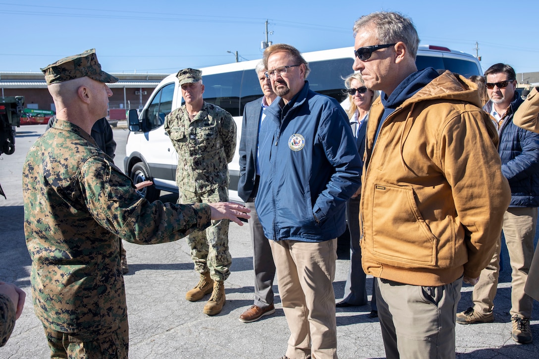 U.S. Marine Corps Sgt. Maj. David Wilson, left, the sergeant major of II Marine Expeditionary Force, speaks to U.S. House of Representatives Chuck Edwards (R-NC), left, and Matt Cartwright (D-PA), right, at Marine Corps Base Camp Lejeune, North Carolina, Dec. 2, 2024. The Congressional Delegation (CODEL) was a bi-partisan visit consisting of House Appropriations Subcommittee on Defense (HAC-D) representatives who learned more about II MEF operations, capabilities and address issues related to DoD appropriations in North Carolina. (U.S. Marine Corps photo by Sgt. Jacquilyn Davis)