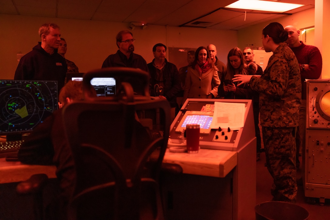 U.S. Marine Corps Staff Sgt. Alexandra Lamas, right, an air traffic controller assigned to Headquarters and Headquarters Squadron, Marine Corps Air Station New River, discusses U.S. Marine Corps air traffic control during a tour at Marine Corps Air Station New River, North Carolina, Dec. 2, 2024. The Congressional Delegation (CODEL) was a bi-partisan visit consisting of House Appropriations Subcommittee on Defense (HAC-D) representatives who learned more about II MEF operations, capabilities and address issues related to DoD appropriations in North Carolina. (U.S. Marine Corps photo by Cpl. Maurion Moore)