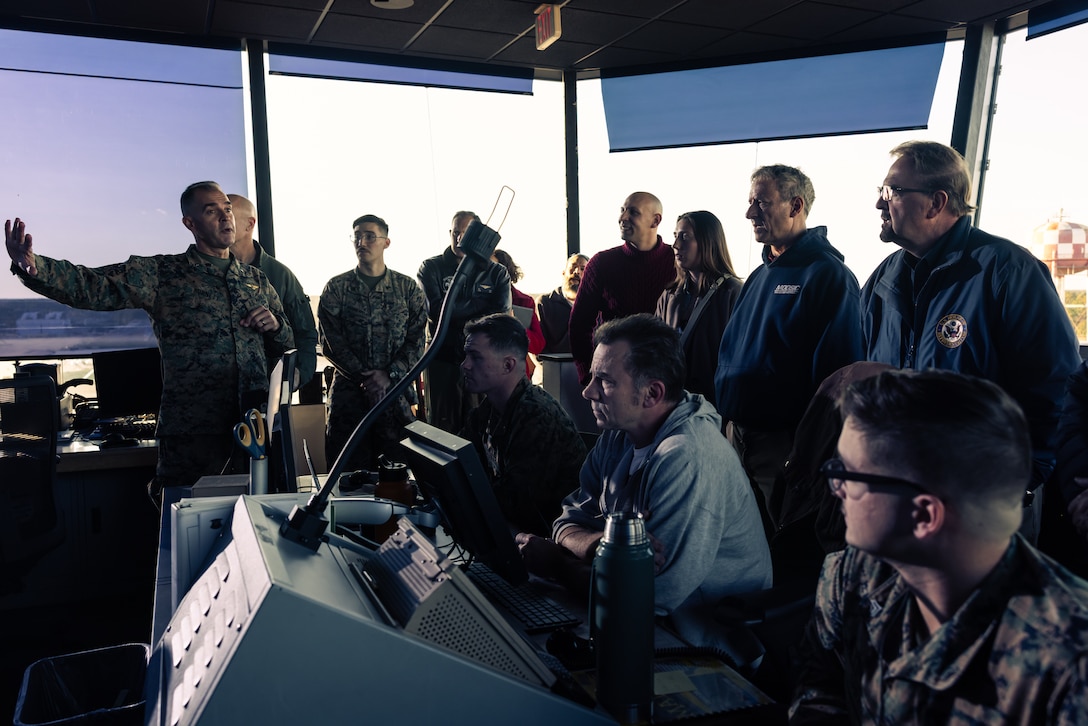 U.S. Marine Corps Col. Garth Burnett, left, commanding officer, Marine Corps Air Station New River, discusses U.S. Marine Corps air traffic control capabilities during a tour at Marine Corps Air Station New River, North Carolina, Dec. 2, 2024. The Congressional Delegation (CODEL) was a bi-partisan visit consisting of House Appropriations Subcommittee on Defense (HAC-D) representatives who learned more about II MEF operations, capabilities and address issues related to DoD appropriations in North Carolina. (U.S. Marine Corps photo by Cpl. Maurion Moore)