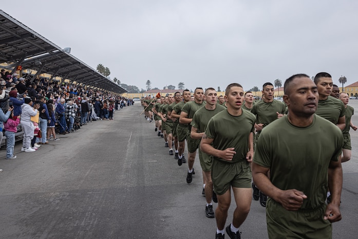 The new U.S. Marines of Kilo Company, 3rd Recruit Training Battalion, participate in a motivational run at Marine Corps Recruit Depot San Diego, California, Dec. 5, 2024. The company motivational run is a three-mile cadence run conducted around the Depot and is the last physical training event the Marines will conduct before they graduate from MCRD San Diego. The event is also the first-time friends and families will see their newly transformed Marines. (U.S. Marine Corps photo by Lance Cpl. Jacob Hutchinson)