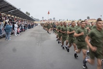 The new U.S. Marines of Kilo Company, 3rd Recruit Training Battalion, participate in a motivational run at Marine Corps Recruit Depot San Diego, California, Dec. 5, 2024. The company motivational run is a three-mile cadence run conducted around the Depot and is the last physical training event the Marines will conduct before they graduate from MCRD San Diego. The event is also the first-time friends and families will see their newly transformed Marines. (U.S. Marine Corps photo by Lance Cpl. Jacob Hutchinson)