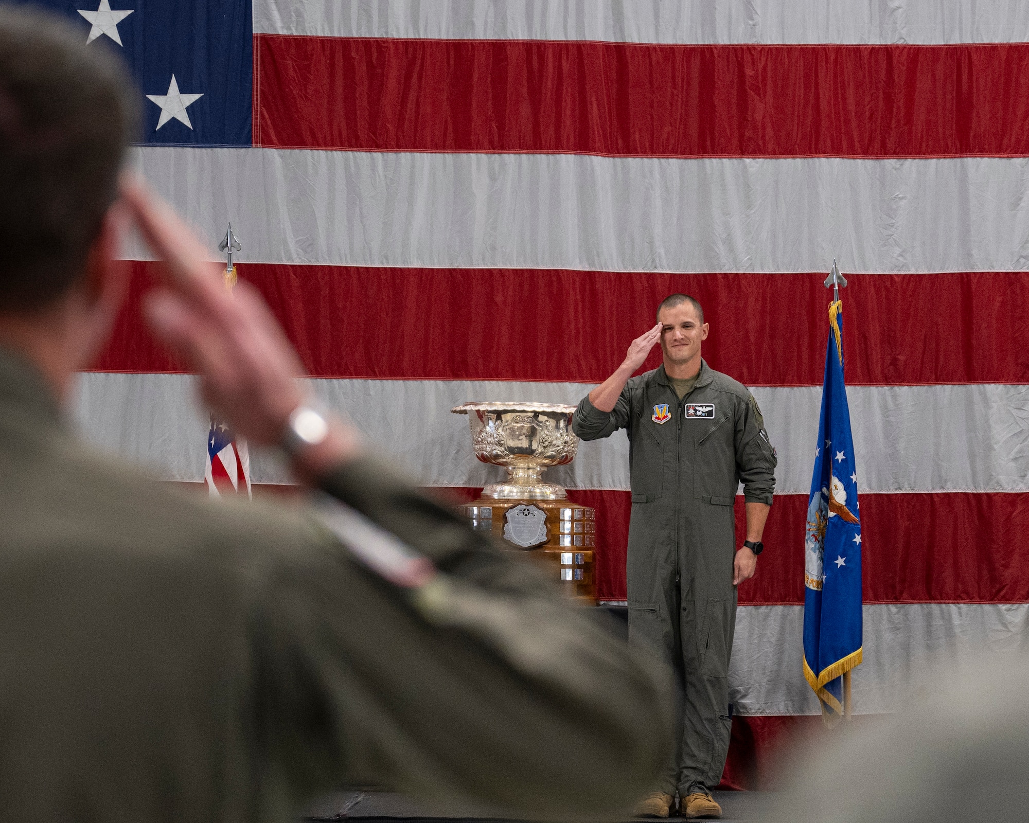 A photo of an officer saluting during a change of command ceremony