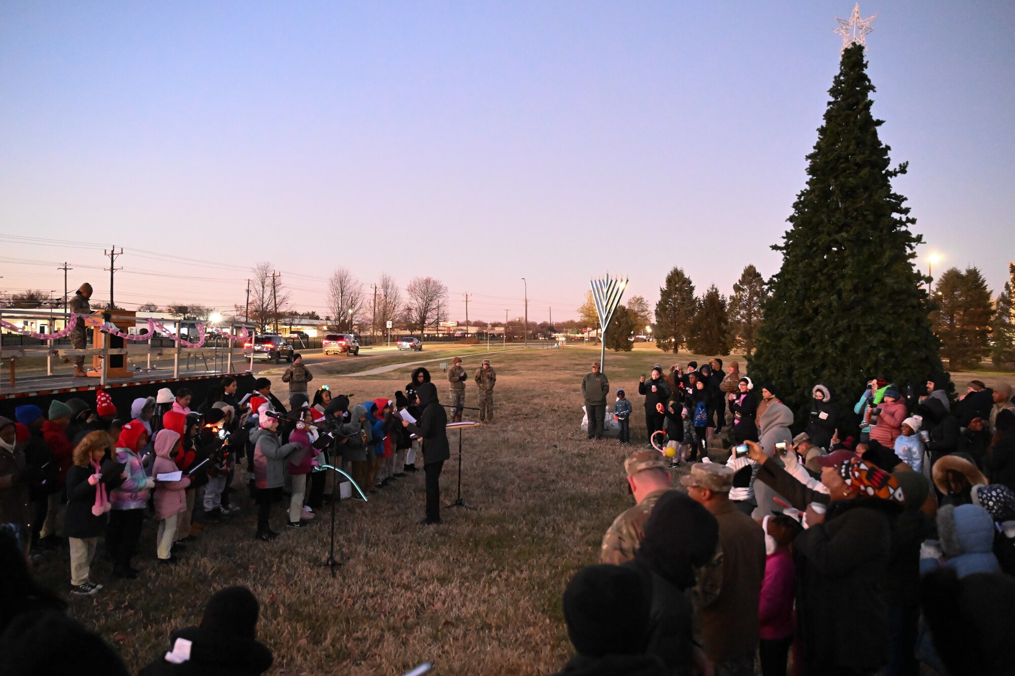 Students from Imagine Andrews Public Charter School perform Christmas carols during the annual Christmas Tree and Menorah Lighting ceremony at Joint Base Andrews, Md., Dec. 5, 2024. The event marked the start of the holiday season with music, food, and entertainment to strengthen the community bonds that support service members and their families.